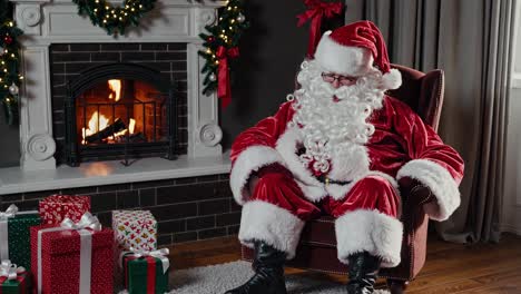 santa claus sleeping by the fireplace