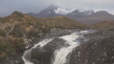 The-view-of-the-Cuillins-and-a-rushing-stream-in-Sligachan-on-an-overcast-day