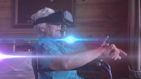 animación de luz azul moviéndose sobre una mujer caucásica mayor sonriente en silla de ruedas usando auriculares vr
