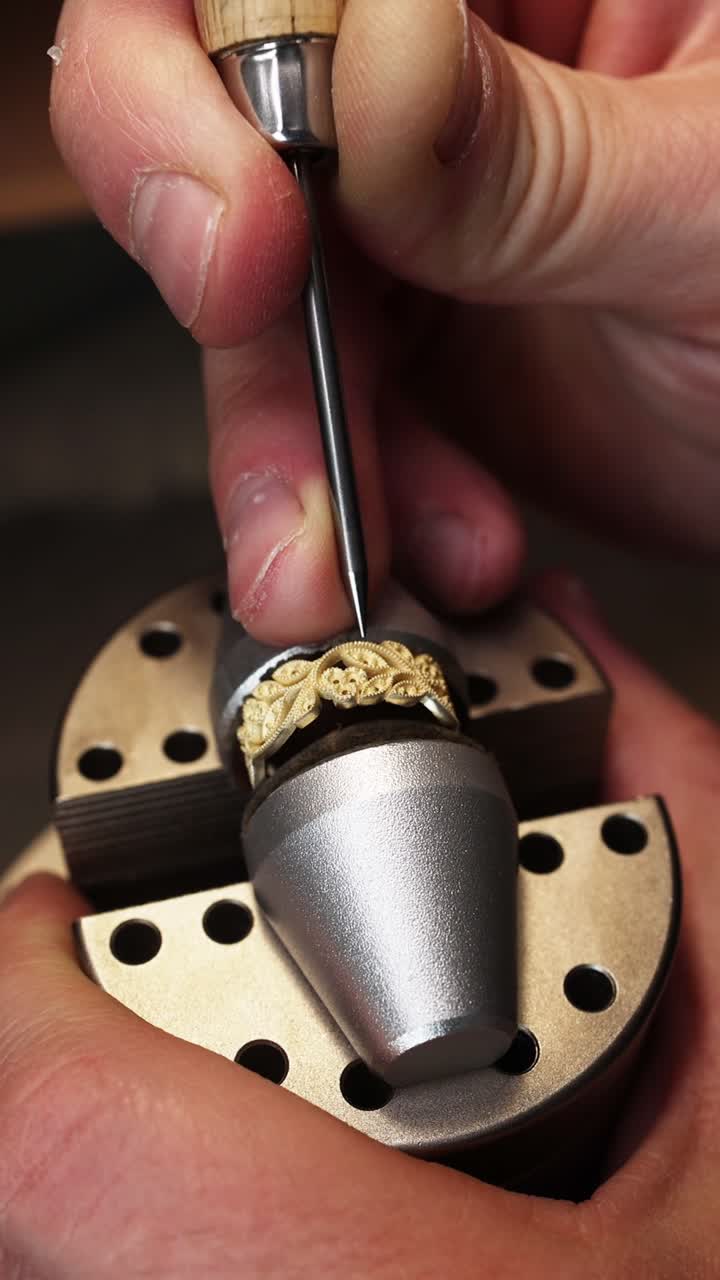 Close-Up of Jeweler's Hands Engraving a Gold Ring