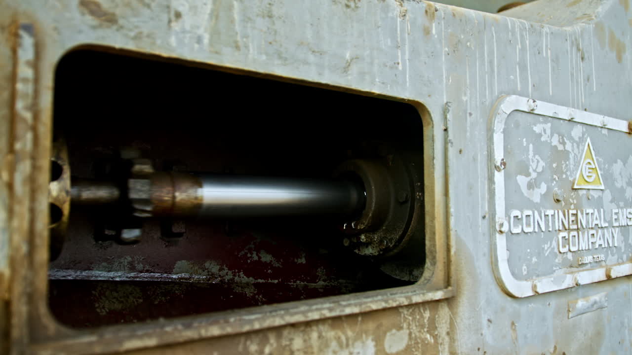 Metal forcer works in the oilfield equipment. Close up. Oil and gas production concept.