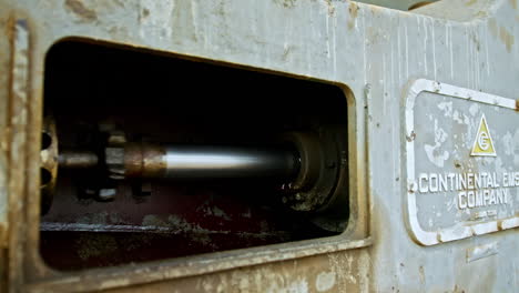 metal forcer works in the oilfield equipment. close up. oil and gas production concept.