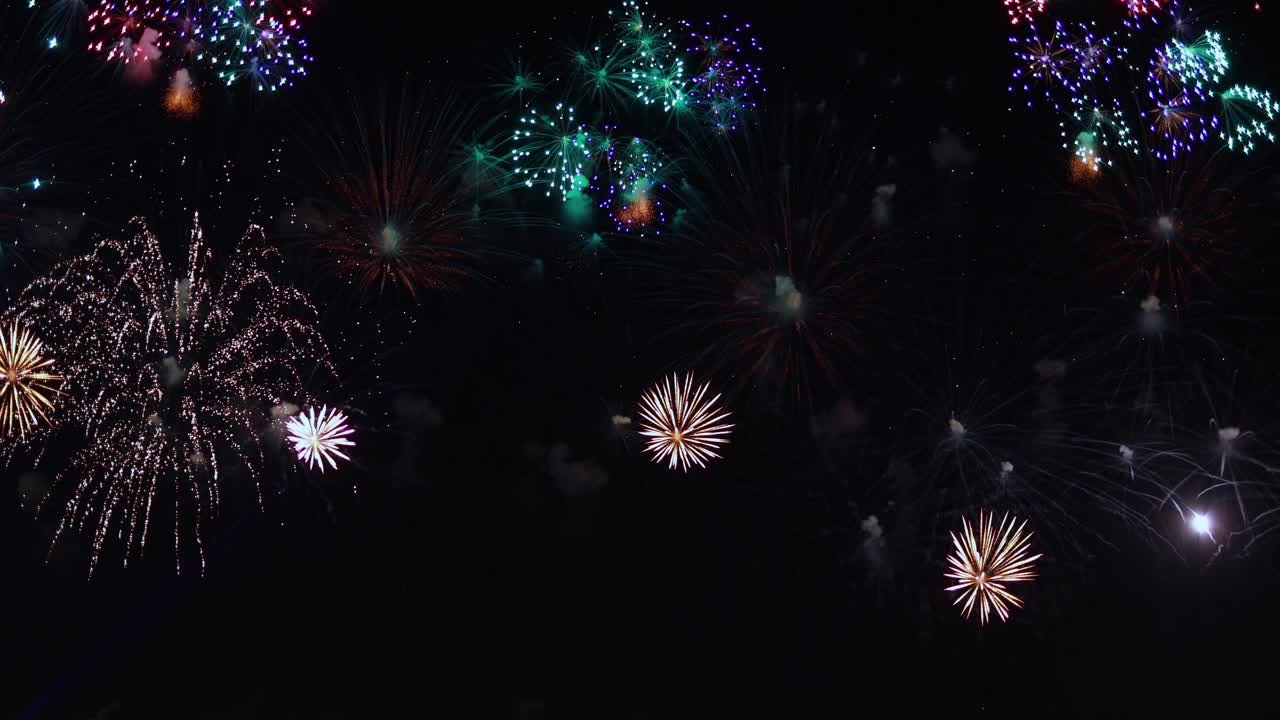 Colorful fireworks exploding in the night sky. Celebrations and events in bright colors.