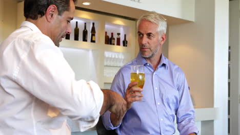 Male-friends-enjoying-a-beer-together