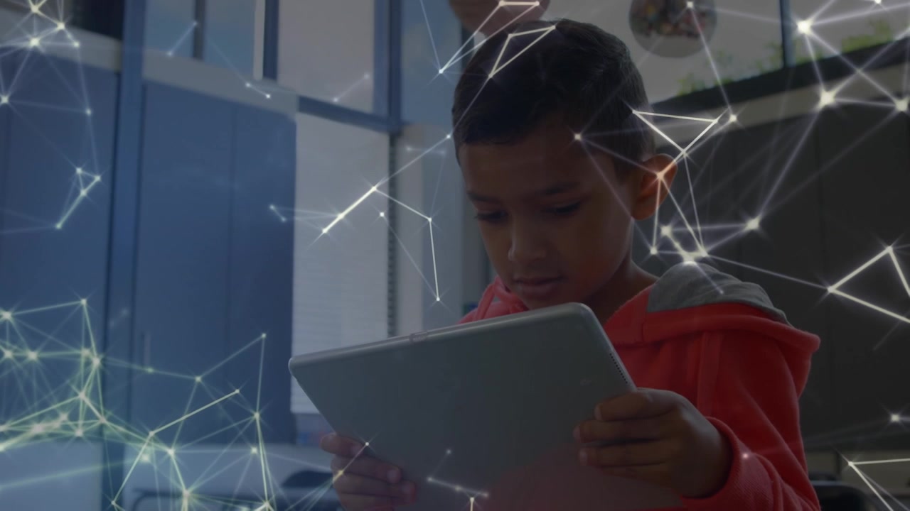 Animation of schoolboy using tablet over shapes