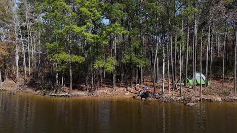 a peaceful camping spot by a quiet lake in a lush forest featuring a cozy tent family vacation a peaceful camping spot by a quiet lake in a lush forest featuring a cozy tent family vacation