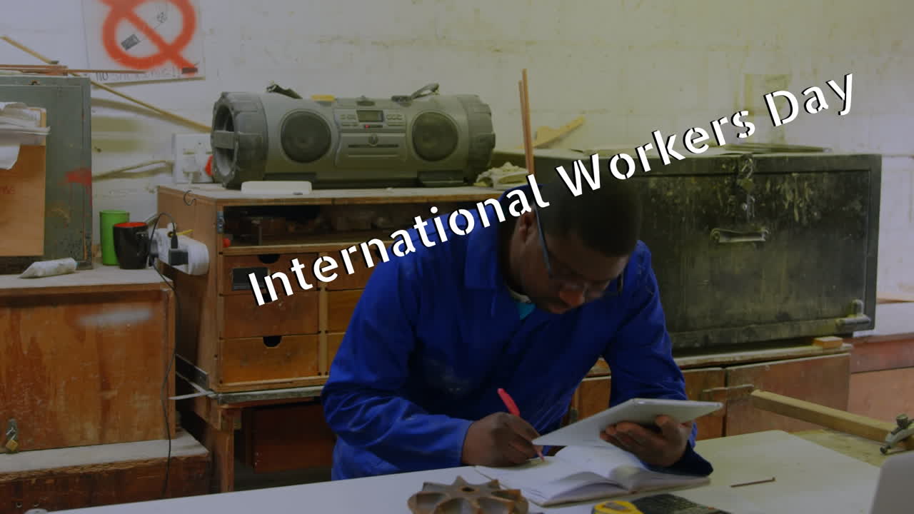 Animation of international workers day over african america worker