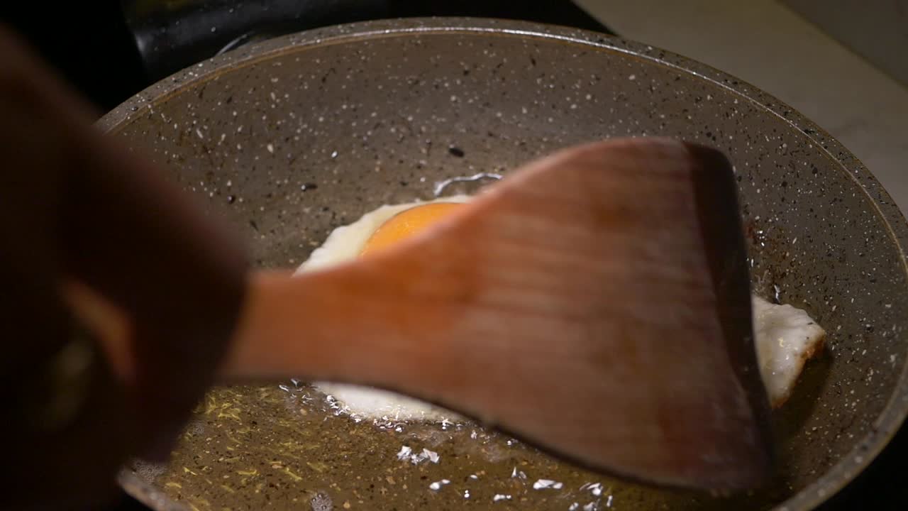Frying an egg in a pan
