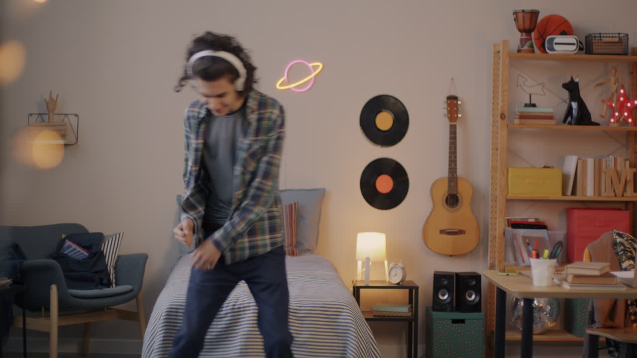 Teenage Boy Dancing in His Bedroom