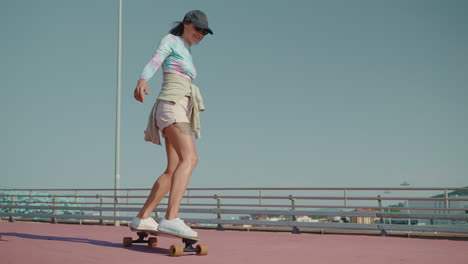 woman skateboarding outdoors