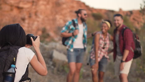 friends taking photos while hiking