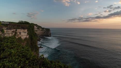 sunset over uluwatu cliff in bali