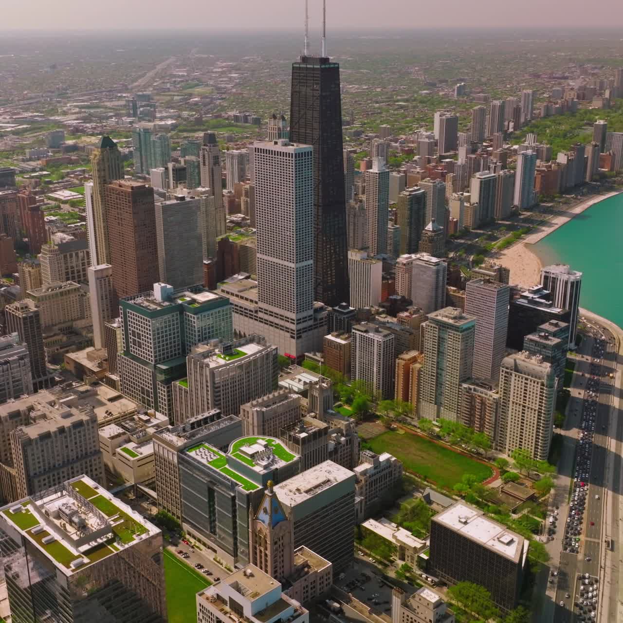 Breathtaking scenery of Chicago city on sunny day. Endless city panorama beside beautiful Lake Michigan