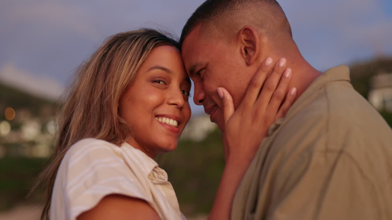 Love, smile and hug with couple at beach
