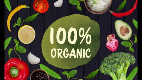 100% organic text over various fresh vegetables and herbs on dark background