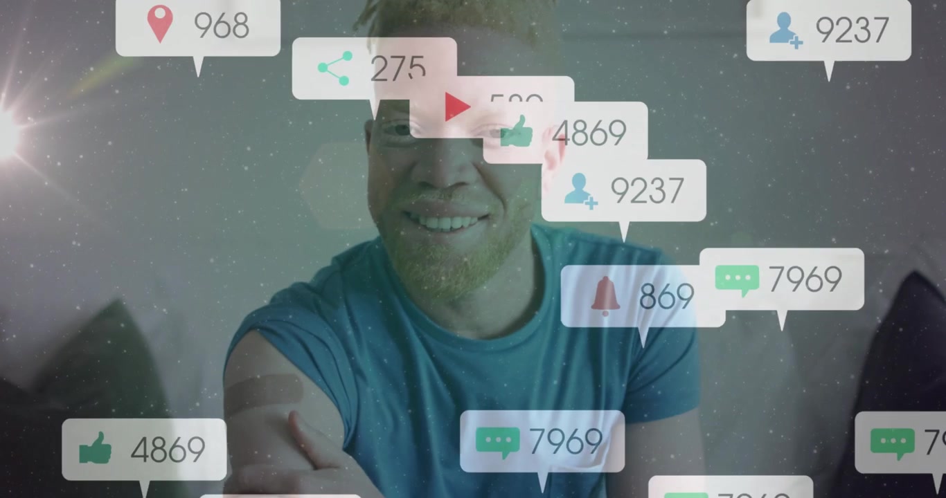 Man placing hand on shoulder and smiling, causing social media notifications multiplying outward