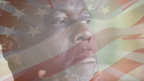 animation of flag of united states of america over portrait af senior african american man