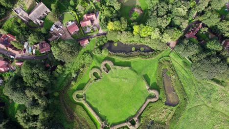 aerial video footage of the remains of bolingbroke castle a 13th century hexagonal castle, birthplace of the future king henry iv, with adjacent earthwork