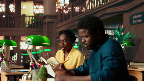 african american students learning a foreign language at the university library