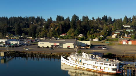 aerial dolly shot of abandoned el conquistador yacht in coos bay oregon