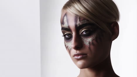 woman with dramatic glitter makeup