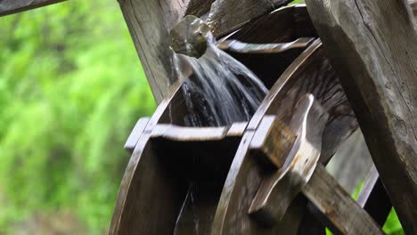 traditional water wheel spinning in namsan park - close up shot