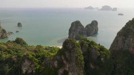 4K-aerial-drone-footage-of-rocky-coast-in-Krabi,-Thailand,-Asia,-Railay-beach