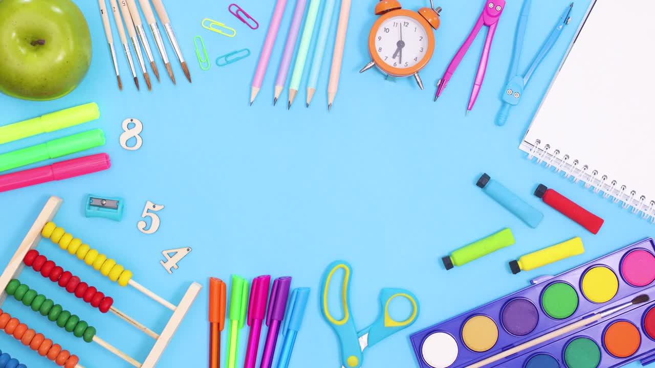 Vibrant back to school tools and stationery make frame for text. Stop motion