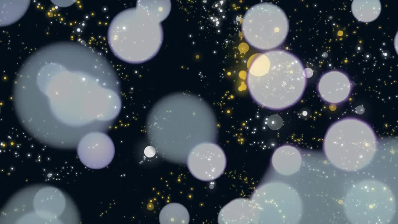 검은 바탕에 움직이는 반 ⁇ 이는 반점들의 디지털로 생성된 비디오