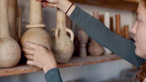 pottery, shelf and small business owner woman