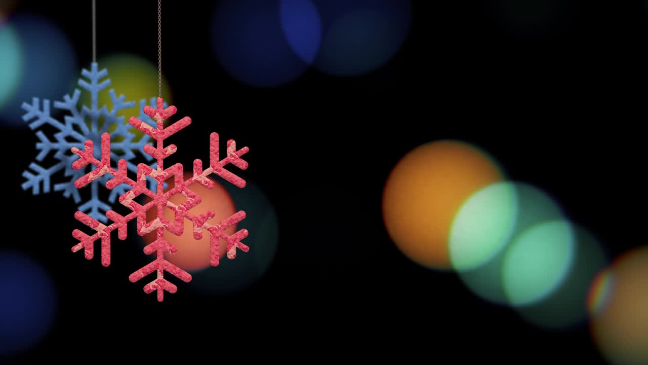 los adornos de copos de nieve de navidad se balancean en el fondo de bokeh archivo de bucle