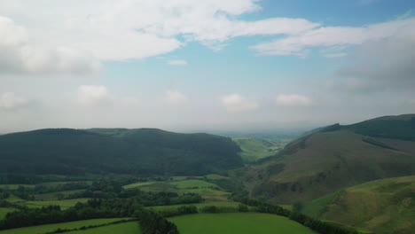 Aerial-tracking-shot-showing-landscape-showing-the-mountains-of-the-Lake-District