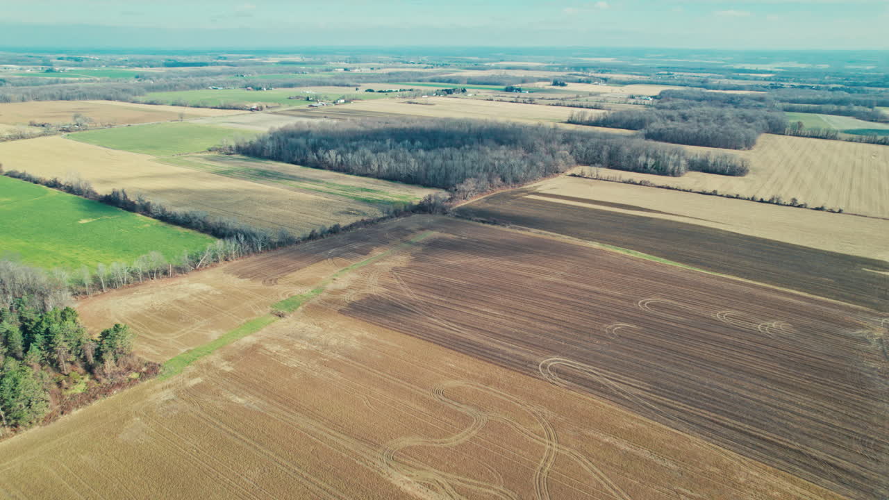 Drone flying over plot of farmland