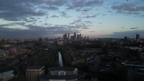 wide view of canary wharf, london's major financial district, featuring modern skyscrapers, glass towers ,and bustling urban activity. a sleek and dynamic representation of london's commercial hub
