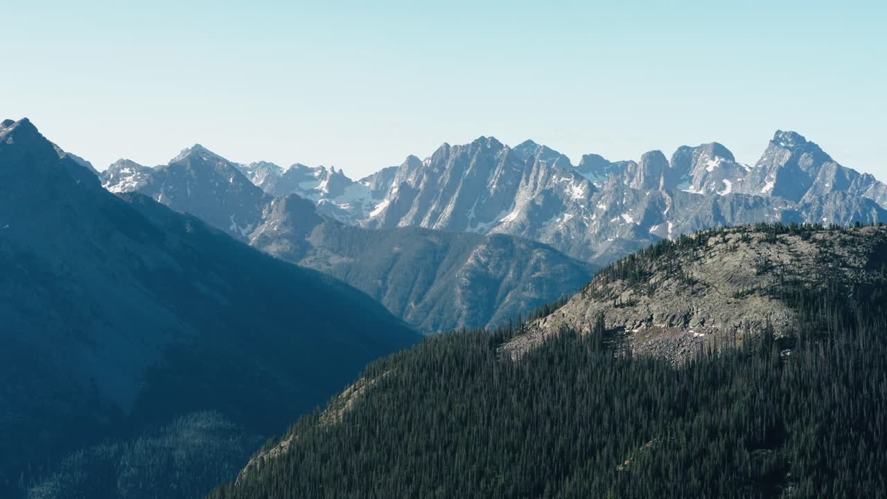 Tracking aerial shot of the snow capped mountains of the San Juan mountain range in Colorado.