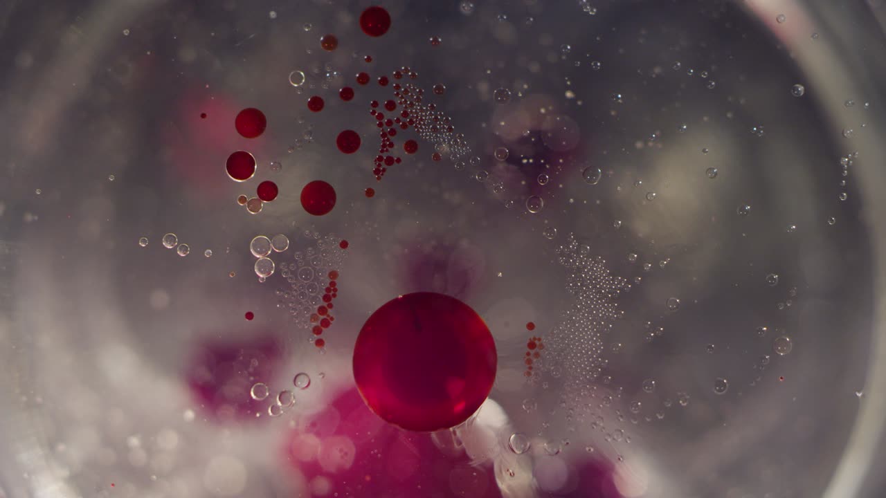 macro resumen de las células de burbujas líquidas rojas y claras que se unen fondo de textura