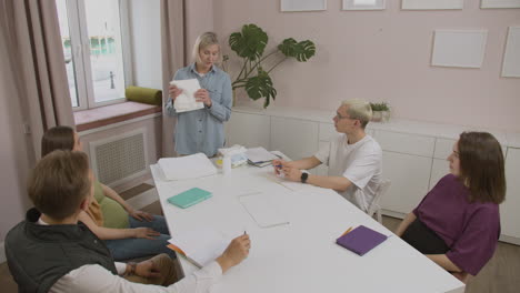 Teacher-showing-products-for-the-baby-in-class