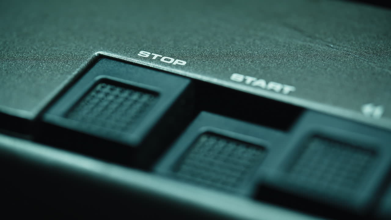 Finger pressing start button tape player closeup. Hands touching music equipment