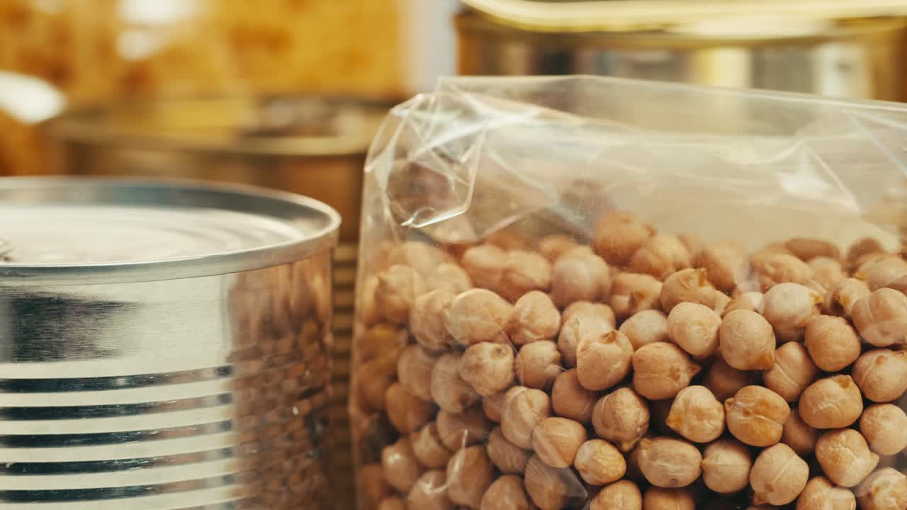 Canned cereals beans fish and vegetables, an assortment of processed foods, supermarket cart online shopping, delivery.