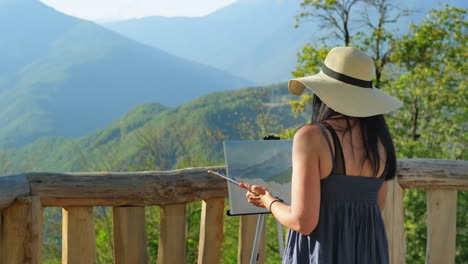 artista pintando un paisaje de montaña