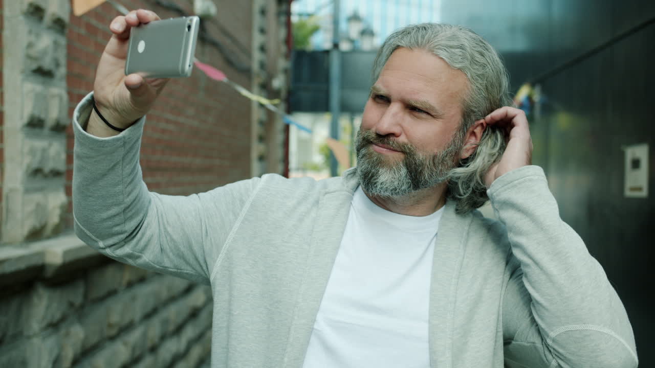 Man taking a selfie in the city