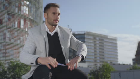 businessman checking time on wristwatch