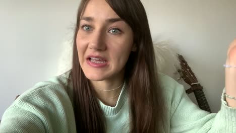 caucasian woman giving bad news over video chat