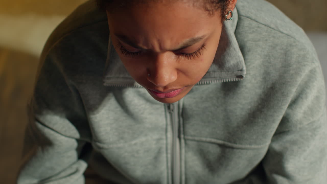 Woman Looking Down with Sad Expression