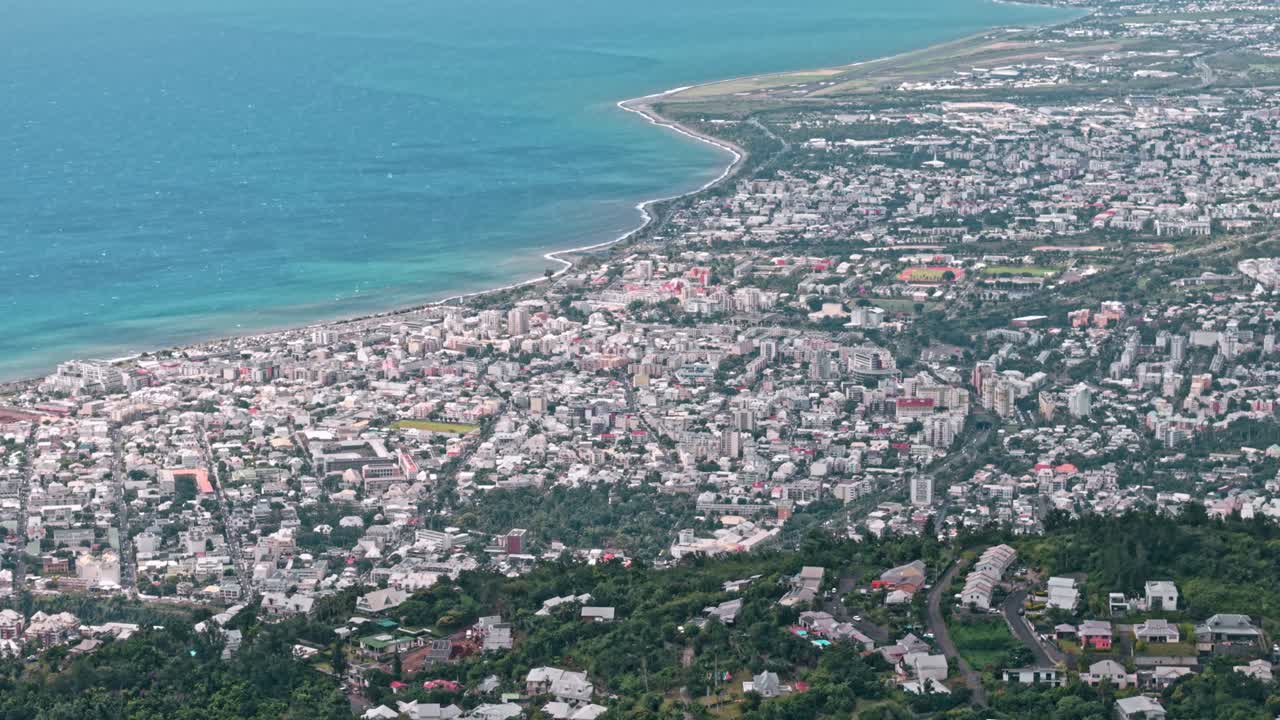 Saint Denis, La Reunion, aerial, telephoto droneshot of the city and coastline