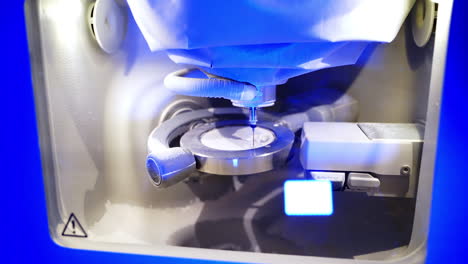 cam machine manufactured teeth. close up view of dental milling machine