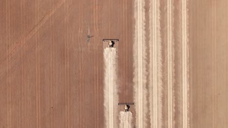 This-footage-captures-the-synergy-of-modern-agricultural-technology,-showcasing-the-essential-role-of-header-fronts-in-the-wheat-harvesting-process