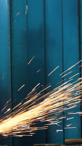 female welder working at work shop