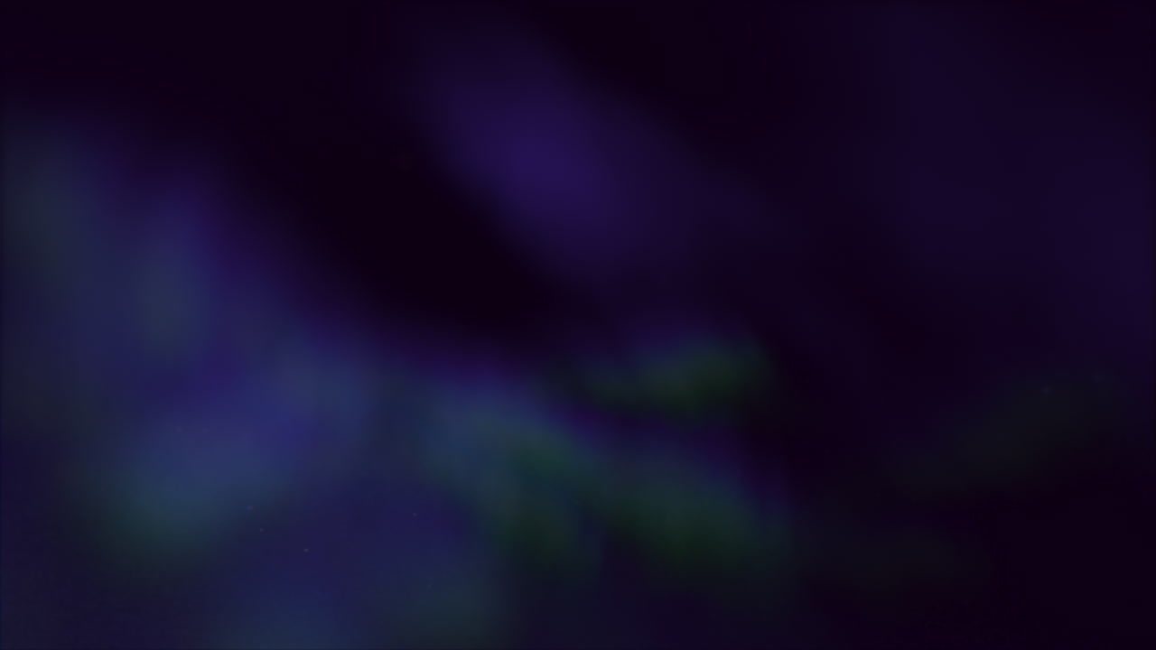 A captivating image of the night sky showcasing a radiant blue and purple aurora borealis, a mesmerizing natural light display in Earth's polar regions energized by solar wind particles