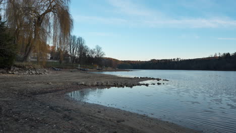 calm afternoon at the beach at slapy reservoir on vltava river in županovice, czechia